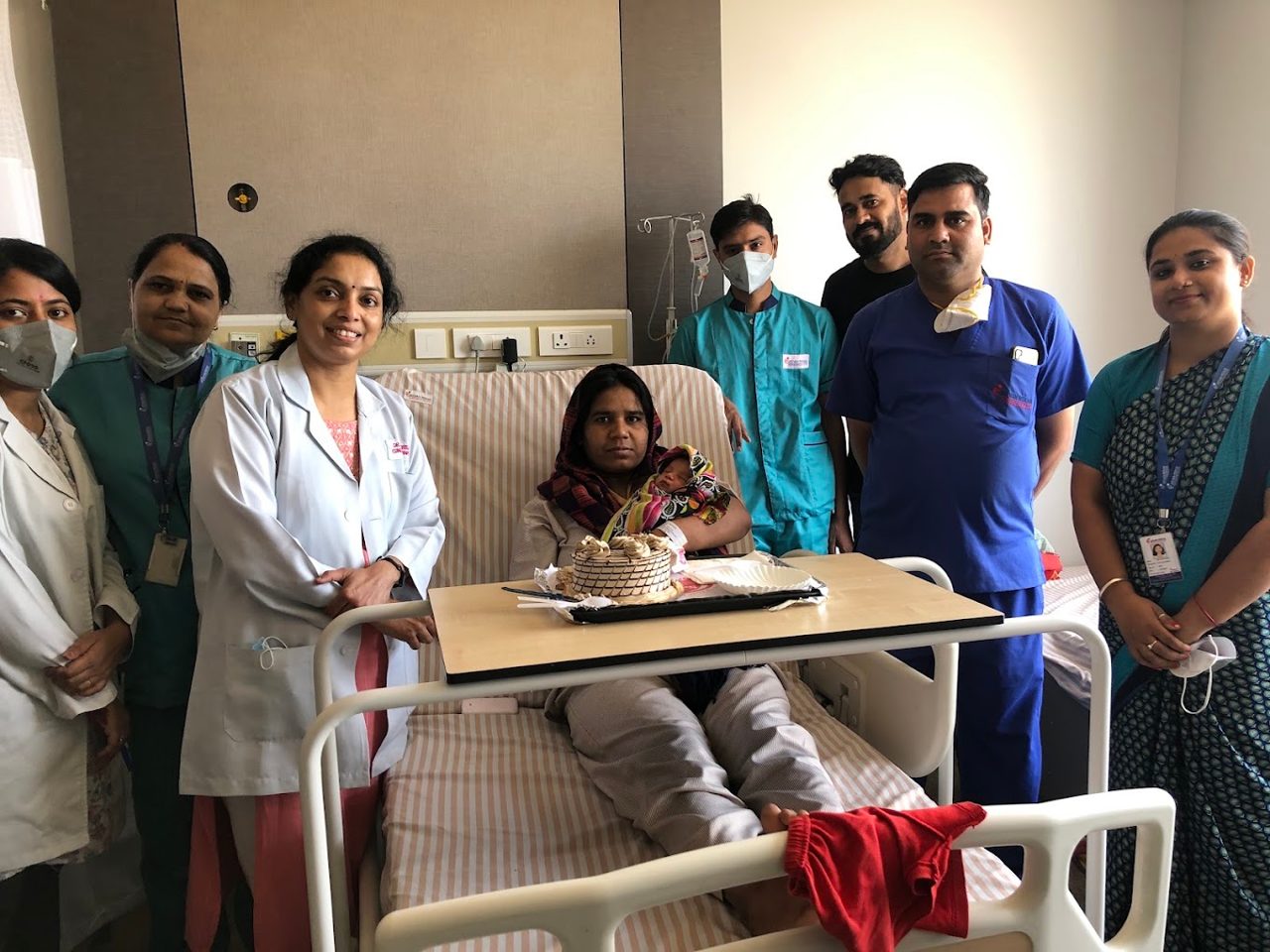 Hospital team with mother and newborn